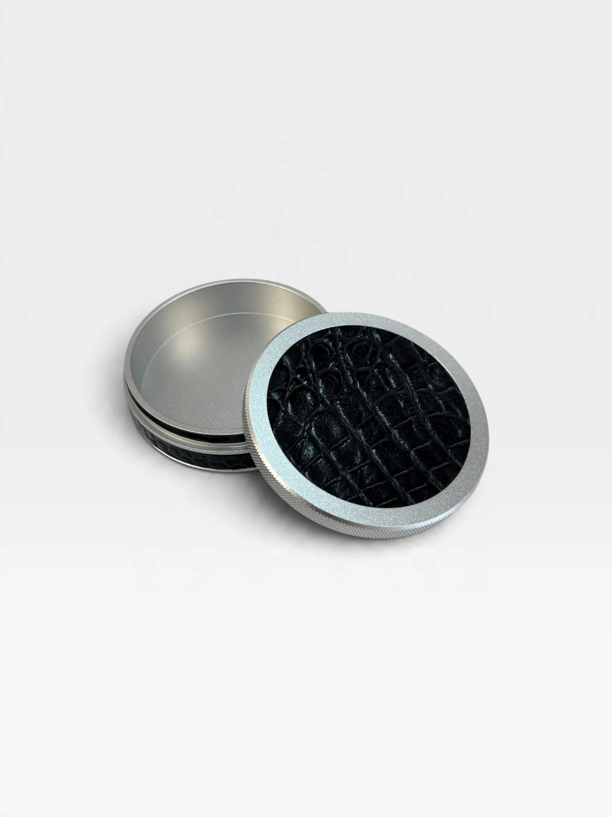Open silver Ruk Slim Can with black croc-embossed genuine leather and an empty aluminum interior.