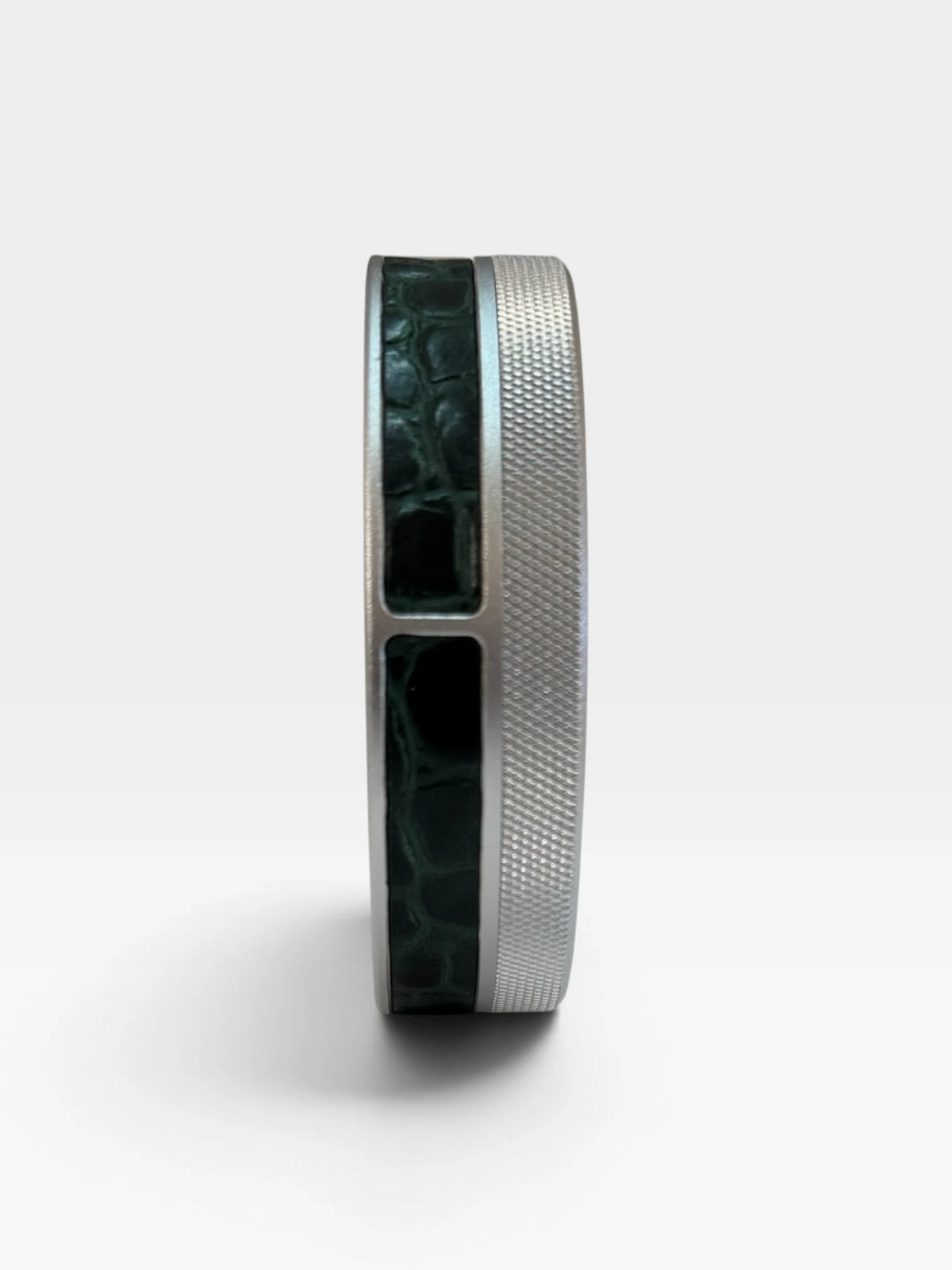 Side view of the silver Ruk Slim Can with green croc-embossed genuine leather.